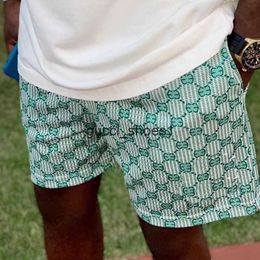 Shorts de designer masculino luxo casual de alta qualidade shorts malha respirável cintura elástica cordão bolso padrão impresso calças de praia secagem rápida shorts verão