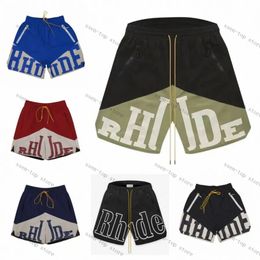Shorts de grife rhude curto verão moda praia calças masculinas de alta qualidade streetwear tamanho solto calças de basquete de cinco pontos