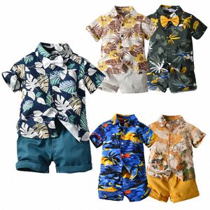 Комплекты детской одежды Короткие рубашки с цветочным принтом и шортами для мальчиков Повседневные костюмы из двух предметов для малышей Детская одежда Молодежная пляжная верхняя одежда размер 80-130 см 72oY#
