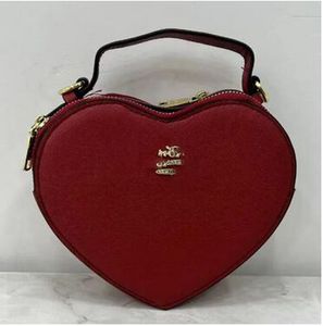 Omuz çantası müşterileri tote çantalar yüksek kaliteli pu deri çanta kadın tasarımcı çanta çantaları kalp şeklinde bayanlar moda crossbody çanta co0127