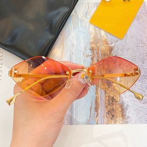 Frauen Sommer Fe4085 Geometrischer Rahmen Sonnenbrillen Designer Neue Metallrahmen ohne Geometrische Orangenlinsen Outdoor -Strand -Freizeit -Sonnenbrille mit Kasten