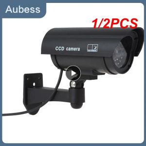 Камеры 1/2pcs Smart Dummy Supilance Camera Camera Indoor/Outdoor Waterpronation Fake CCTV камера безопасности со мигающим красным светодиодным светом
