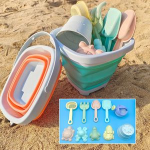Пляжный песок играет вода складные ковша летние игрушки для детей детей на открытом воздухе.