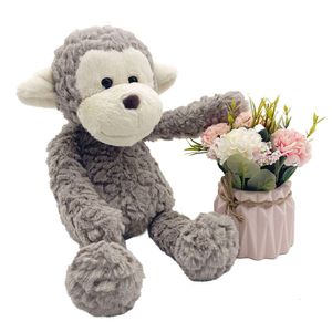 Оптовые материалы обезьяна Пелуше фаршированный мягкий пушистый плюшевый животный, сидящий на заказ игрушку с луком