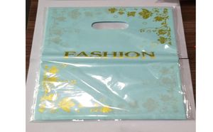 50pcs 2535cm Altın Çiçekler Tasarımı Mavi Plastik Hediye Çantası Giyim Butik Ambalaj Çantaları Tutamaklı Büyük Plastik Alışveriş Çantaları 7024284