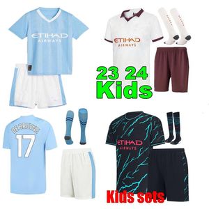 Haaland 23 24 MANCHESTERS Futbol Jersey Kids Kit Mans Şehirler Mahrez De Bruyne Foden 2023 2024 Yeni Futbol Gömlek Çocuk Kiti Setleri Tekdüze Set En Kalite