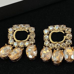 Turuncu büyük oval mücevherler sallanan cazibe harfleri geometri desen kulak sapı lüks elmas bayan moda küpe