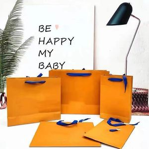 Высококачественная роскошная сумка, желтый портативный бумажный пакет, бумажный пакет для хранения одежды
