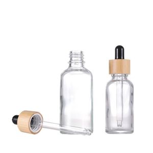 Açık cam esansiyel yağ damlası şişe bambu kapaklar şeffaf kozmetik ambalaj pipet şişesi dökme stok Daijx