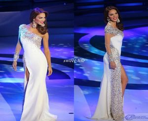 Bayan Venezuela Pageant Gece Elbise 2019 Beyaz Kılıf Bir Omuz Uzun Kollu Yan Bölünmüş Kristaller Seksi Balo Gowns Celebrity D8422704