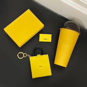 Роскошные сумки унисекс ключевой кошелек желтый буквы монеты кошельки для брелок женщин и мужчин мини -сумка для мешков для наушников, подвесные дизайнерские сумки на плеча
