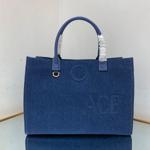 Denim Tote Bag Mulheres Bolsa Grande Capacidade Embreagem Moda Gold Hardware Cabeça Em Relevo Carta Portátil Couro Interno Zipper Bolso Top Quality Lady Bags