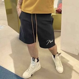 Abbigliamento firmato Rhude Trend Brand Estate Ricamo Lettera Pantaloncini stampati con coulisse Pantaloni divisi casuali Uomo Coppie Joggers Abbigliamento sportivo Fitness da spiaggia all'aperto