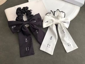 Роскошный дизайнер CH-буквальные волосы резиновые ленты черные белые тканевые волосы кольцо бренд элегантные веревки для женщин для женщин.