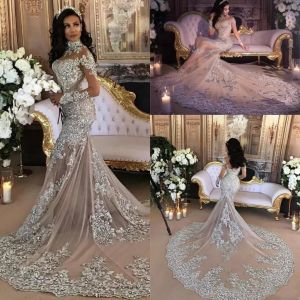 Elegant Champagne Mermaid Wedding Gown with Beaded Lace Applique, High Neck, Sheer Long Sleeves, and Sparkly Illusion Details