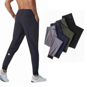 Ll erkek yoga pantolon tasarımcı erkekler kıyafet kıyafet spor hızlı kuru çizim sporu cepleri eşofmanlar pantolonlar erkekler rahat elastik bel 1ihk spor pantolonu cepli erkekler için