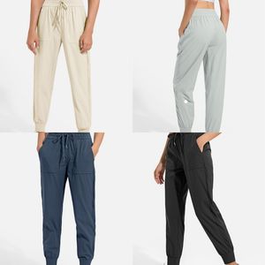 Designer ll mulheres jogging calças de yoga com bolsos macios cintura alta hip lift elástico casual sweatpants perfeito para fitness e yoga pernas com cordão para ajuste ajustável