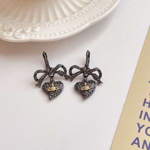 Viviane Kolye Tasarımcısı Viviennes Westwoods Mücevher Titanyum Siyah Yay Knot Tatlı ve Serin Kadınlar İçin Küpeler Popüler Titanyum Altın Halat Knot Kalp