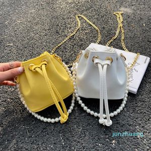 Продукты дизайнера сумок 2022 Простой мини -мини -ковш Корейская текстура иностранных женских жемчужных плечевых сумок 2022