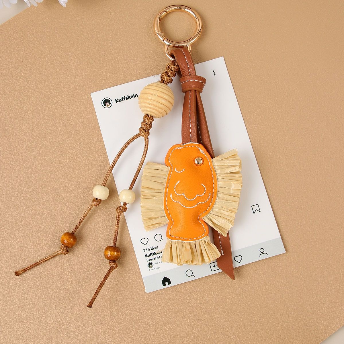hot Selling Designer Charm New Year Series Annual PU Patchwork Rafia Fish Wooden Bead Weaving Rope Creative Bag Pendant_voghion.com