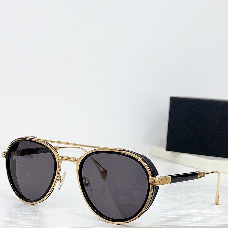 Gold frame and gray lenses