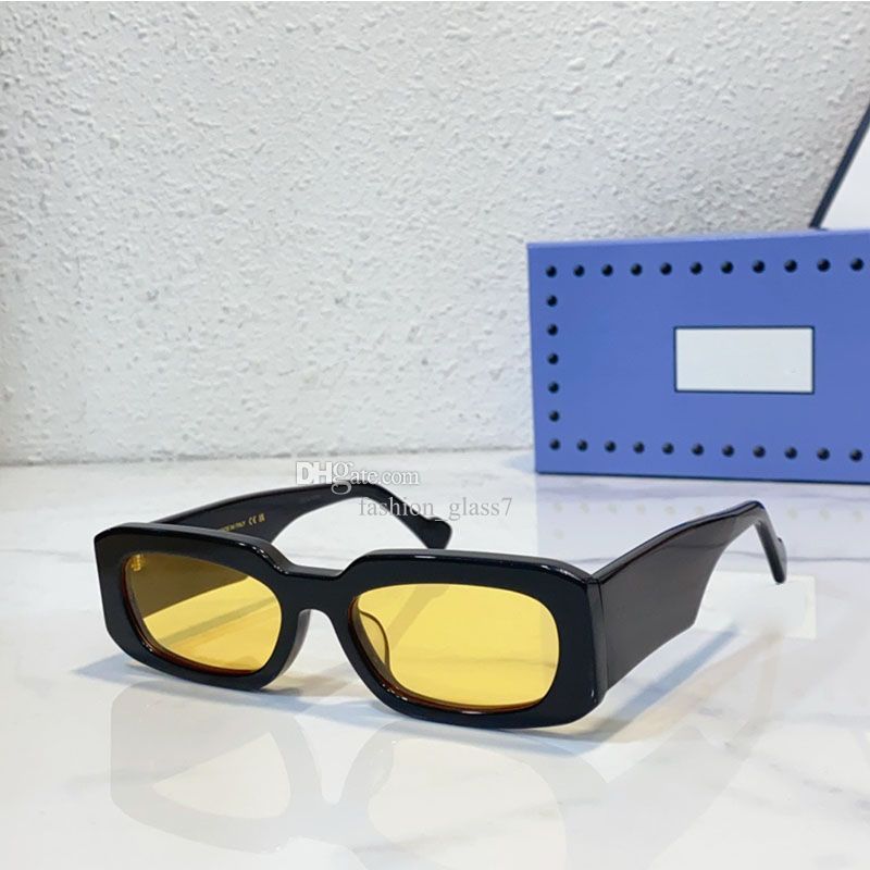 Black frame with yellow lenses