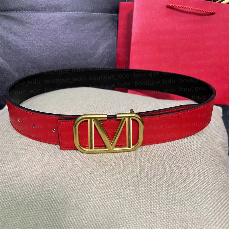 Gold buckle red belt