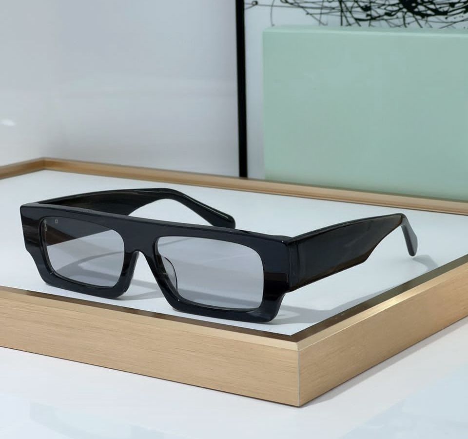 black frame light grey lens