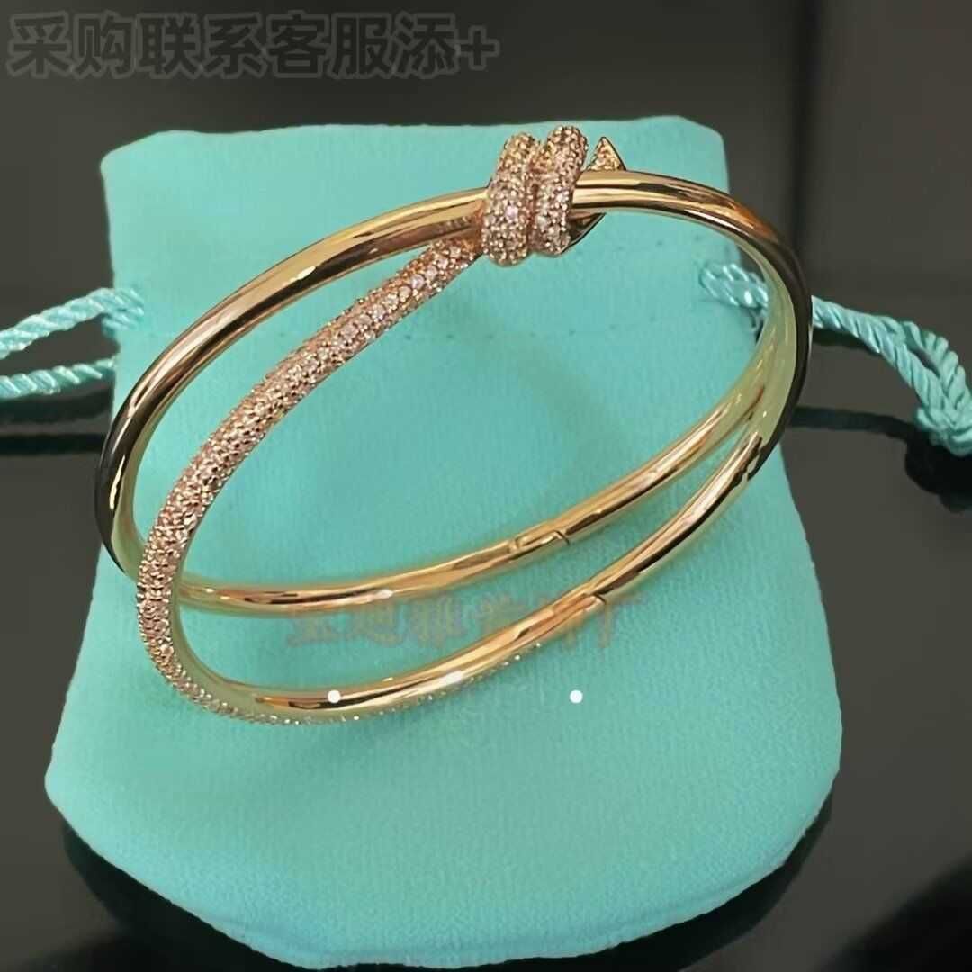 Bracciale intrecciato con diamanti-18 carati