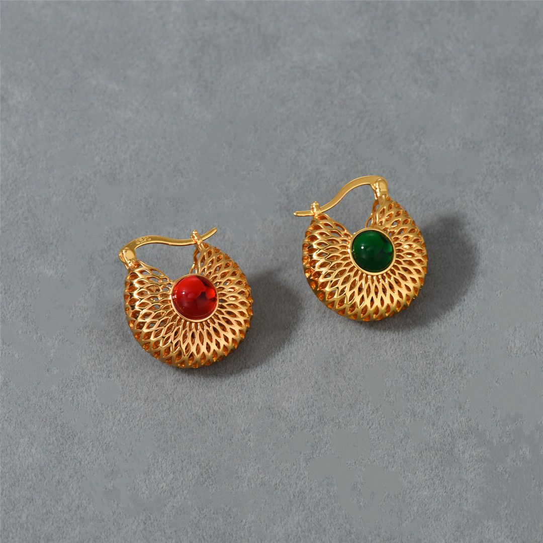 A pair of golden red and green earring