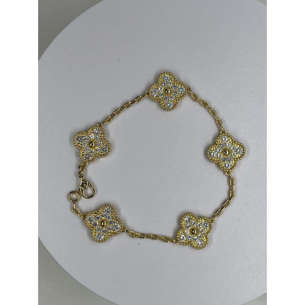 Bracelet cinq fleurs plein de diamants en g