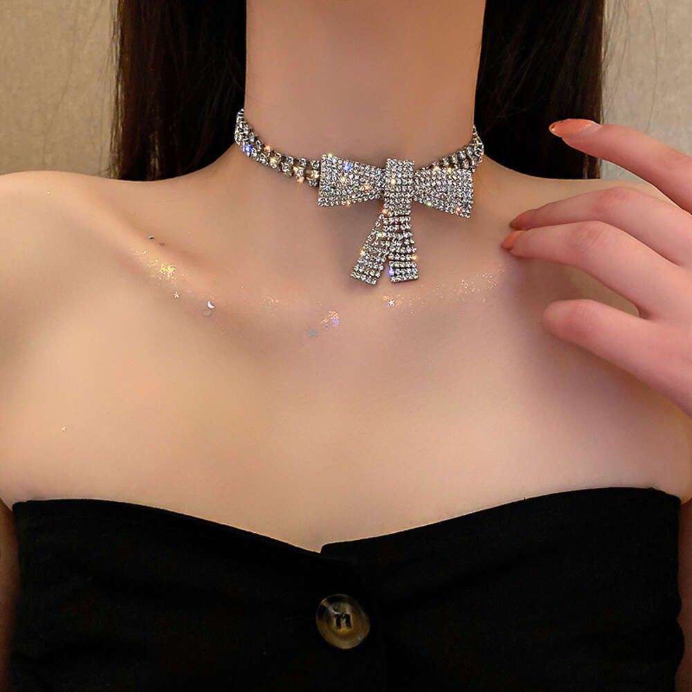 16 # Necklace - Silver Bow