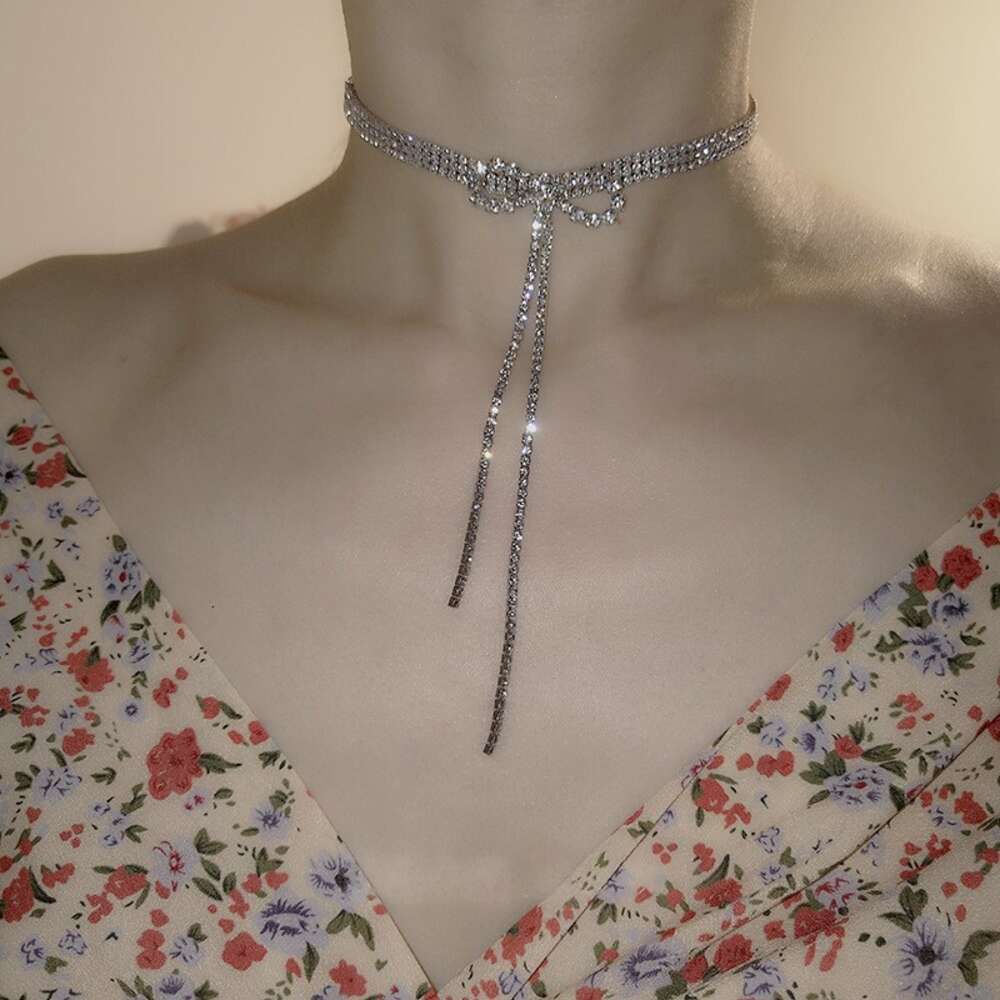 19 # Necklace - Silver Bow Tassel