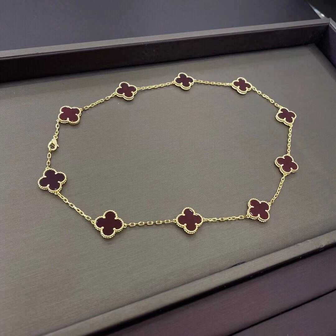 Collier de dix fleurs colorées en or jaune