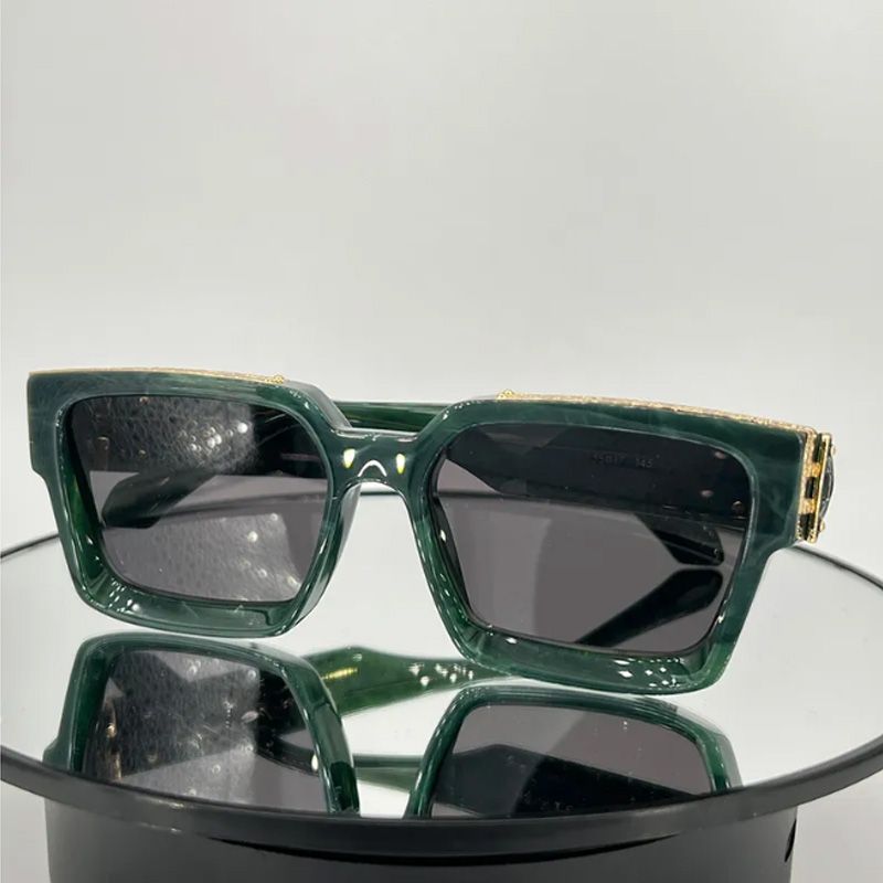 Green frame grey lens