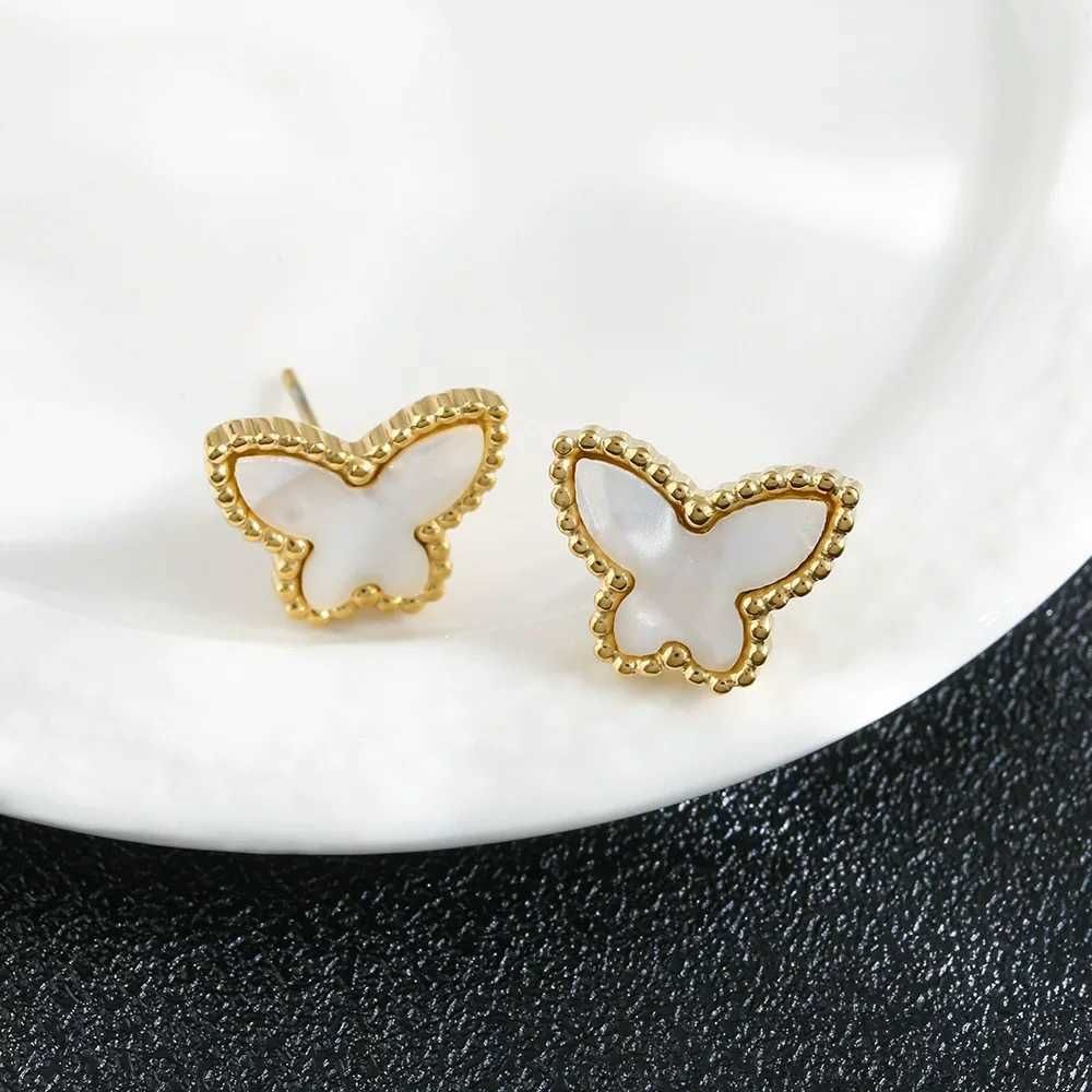 979 boucles d'oreilles papillon blanches