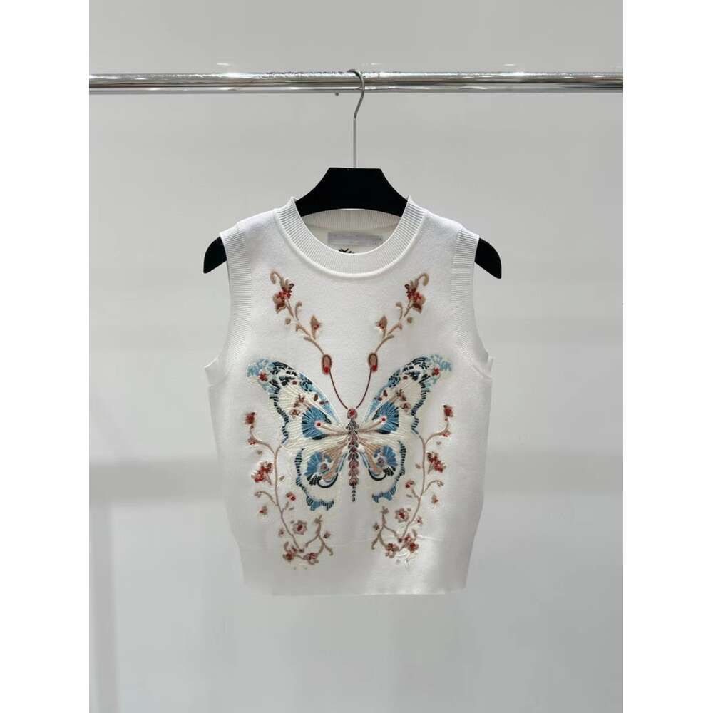 White butterfly vest