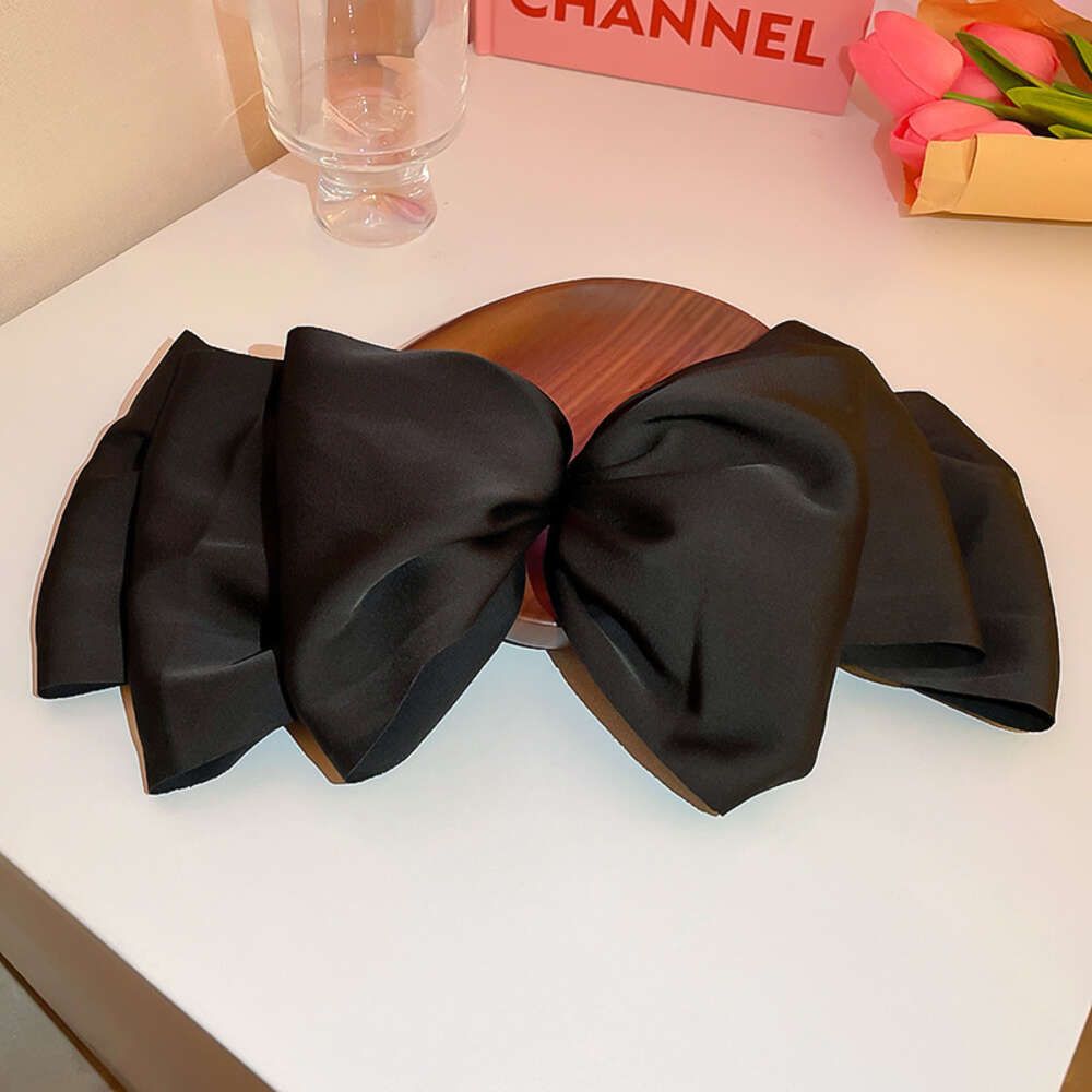 19 # Spring clip - black bow