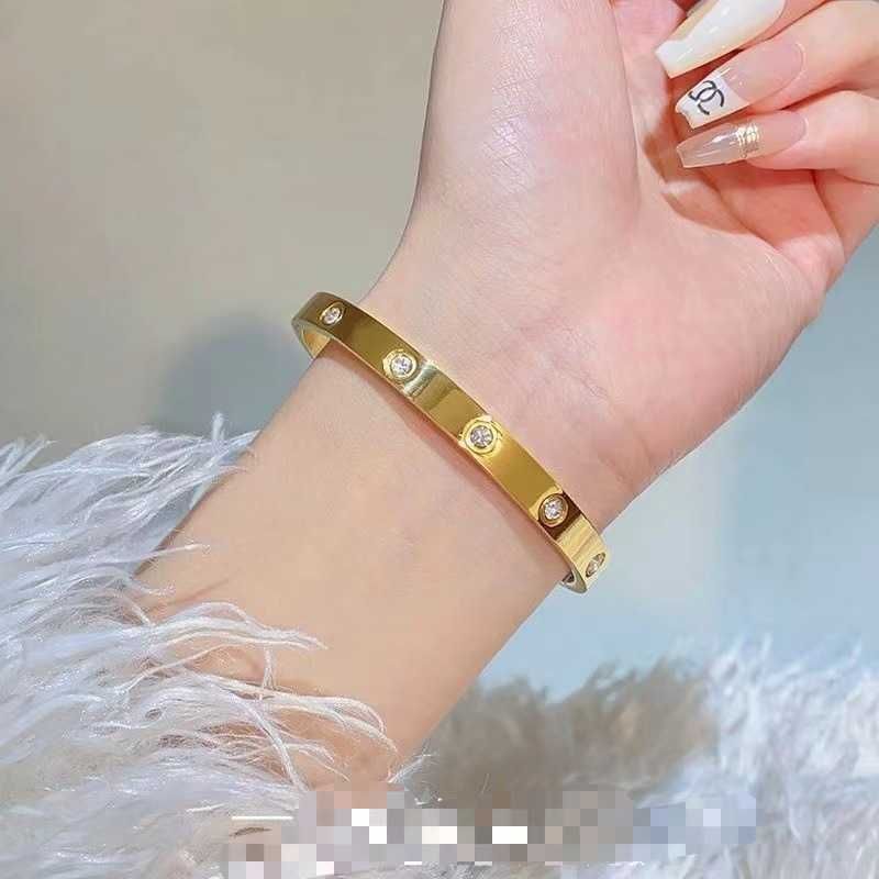 10 braccialetti con zirconi - Oro