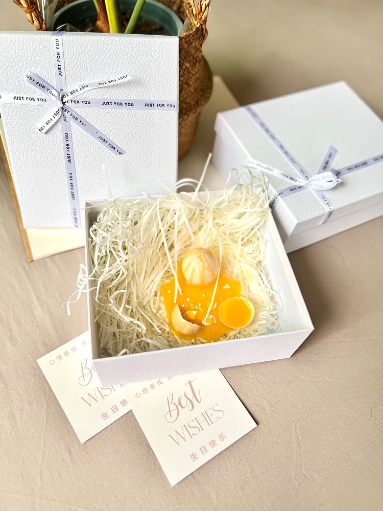 Gift box containing broken egg holder