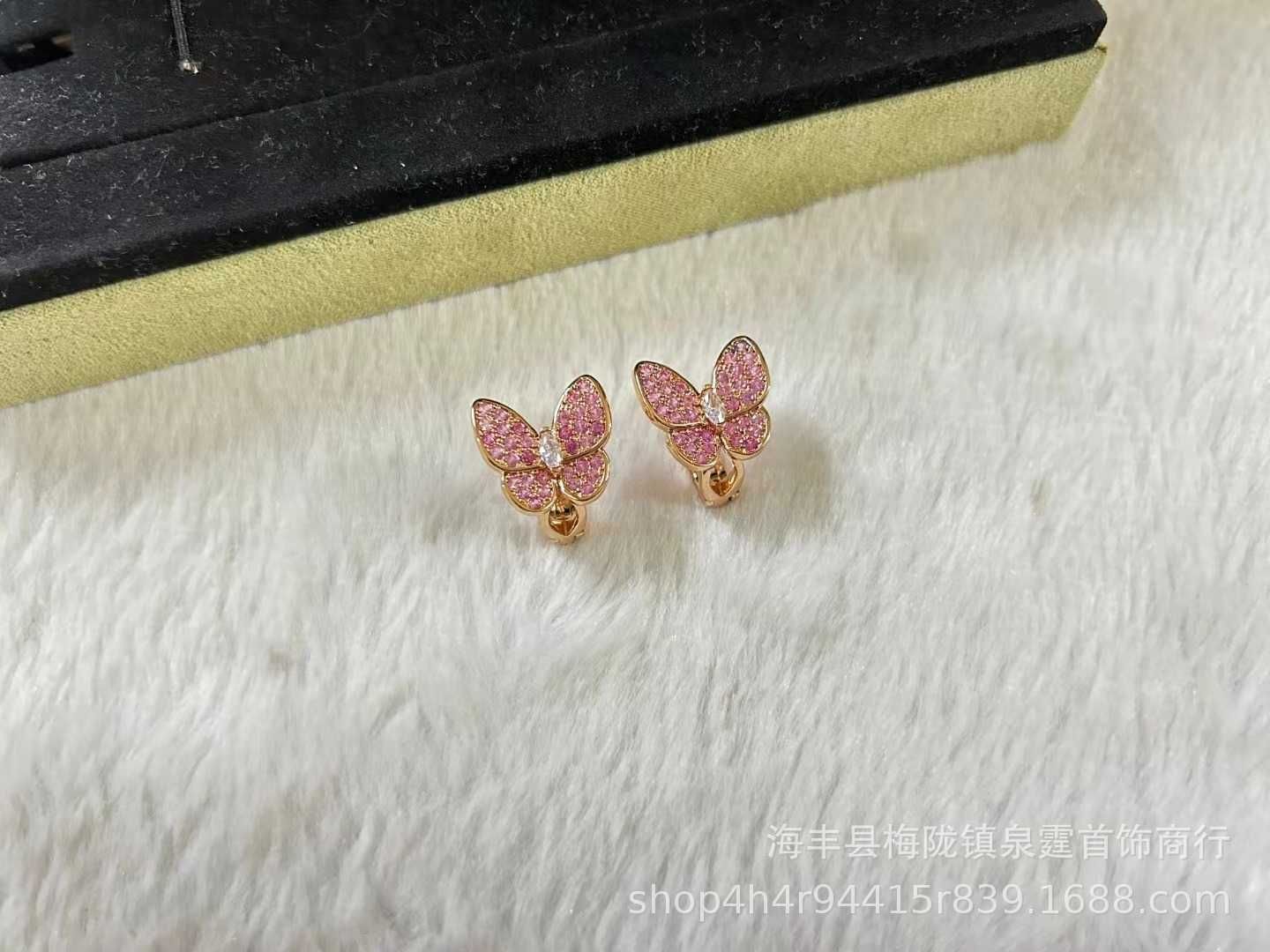 Oro de diamante de mariposa rosa