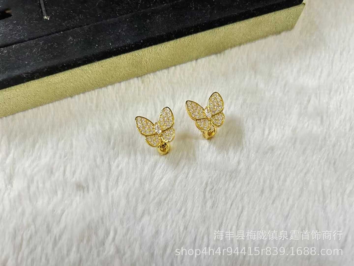 Oro de diamante blanco de mariposa