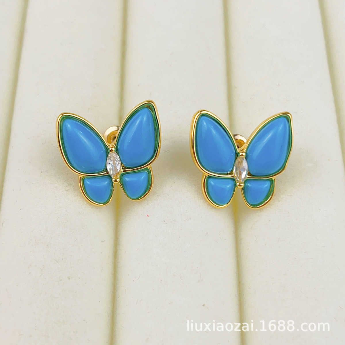 Pendientes de mariposa turquesa