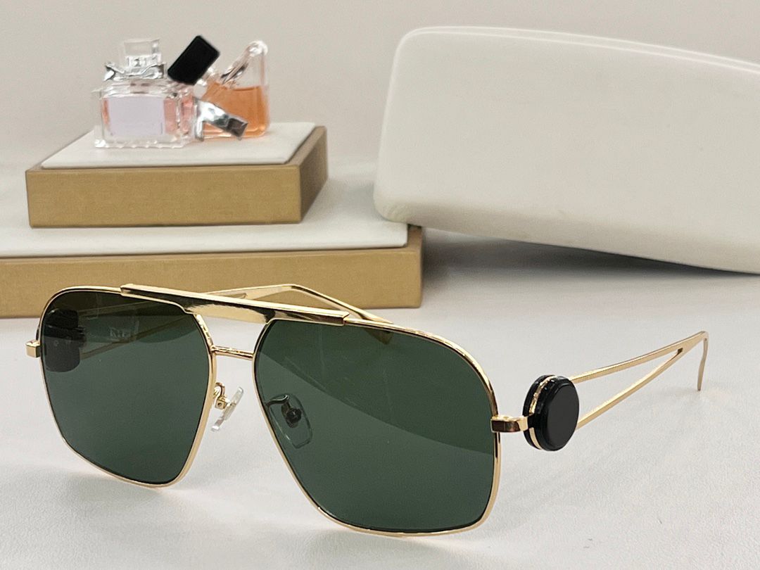 Gold frame green lenses