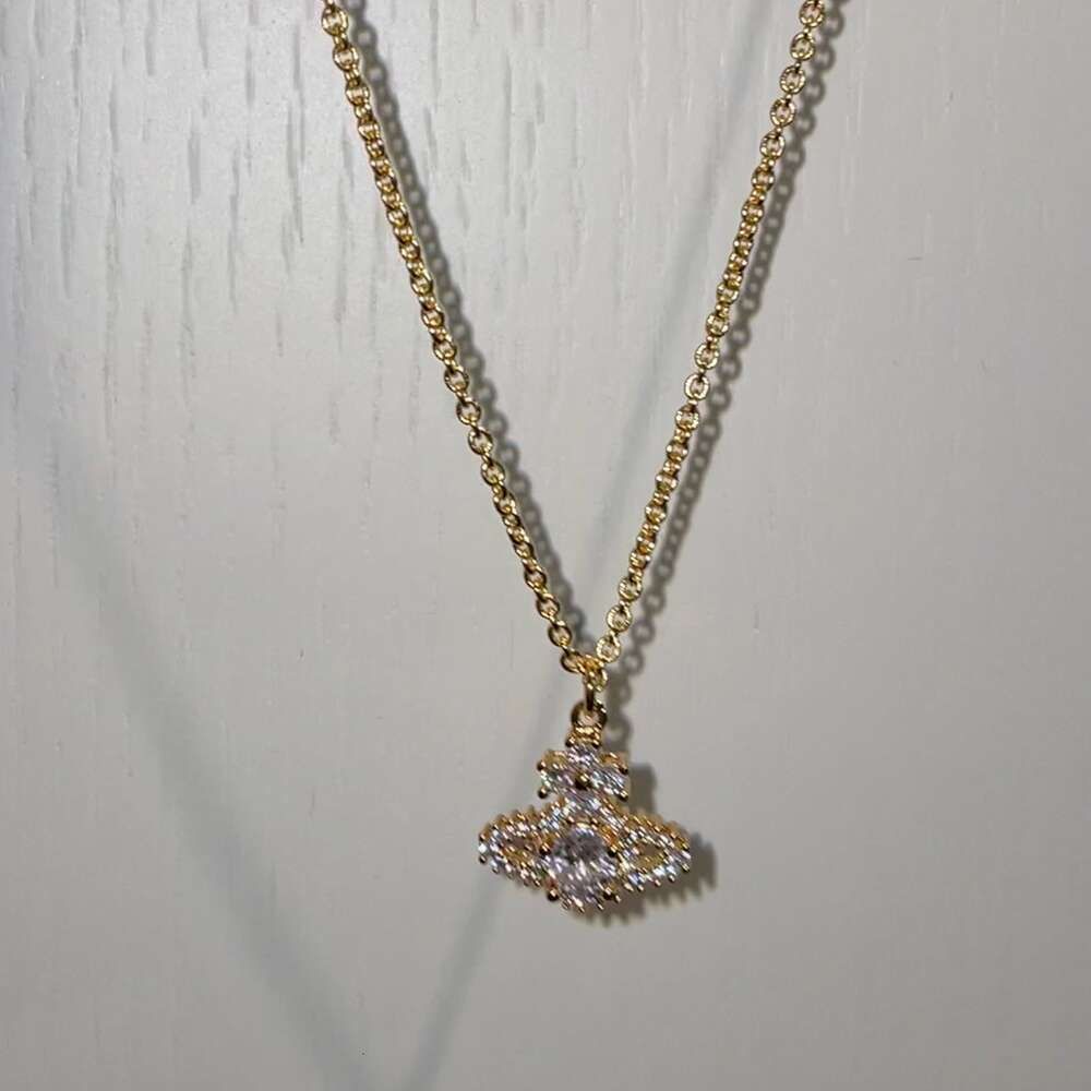 Gouden diamant Saturn ketting