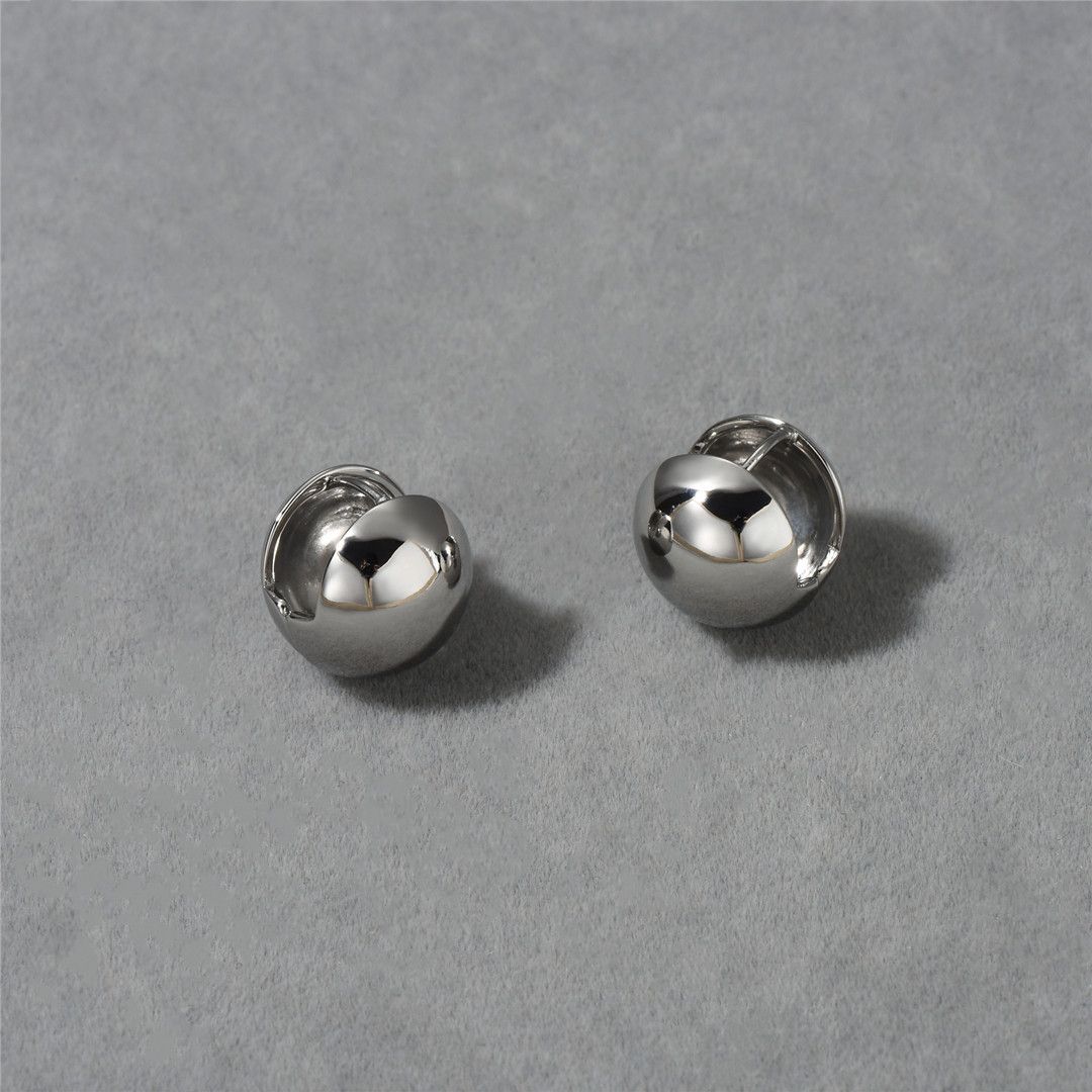 A pair of silver large earrings