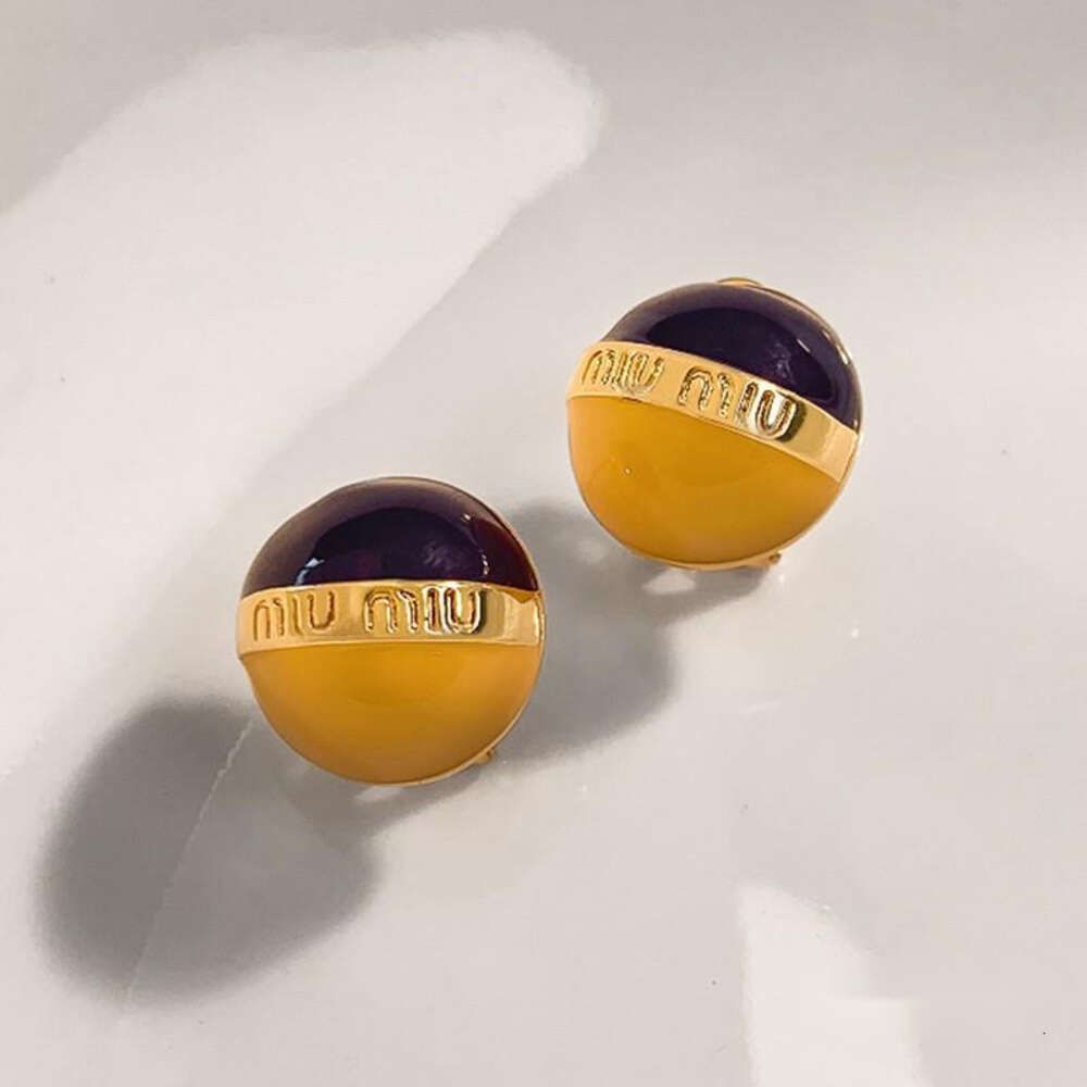 Boucles d'oreilles boule noire et jaune MIU