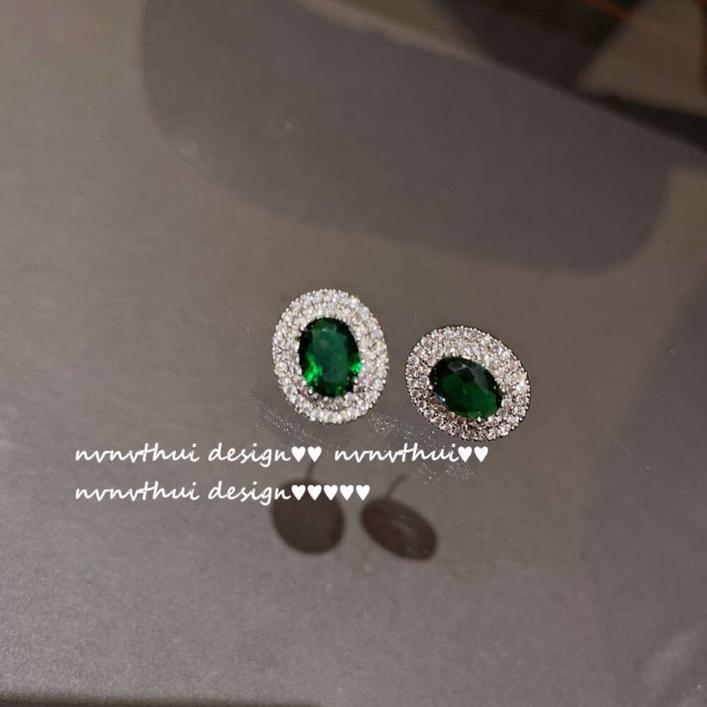 a Pair of Bright Emerald Oval Zircon E