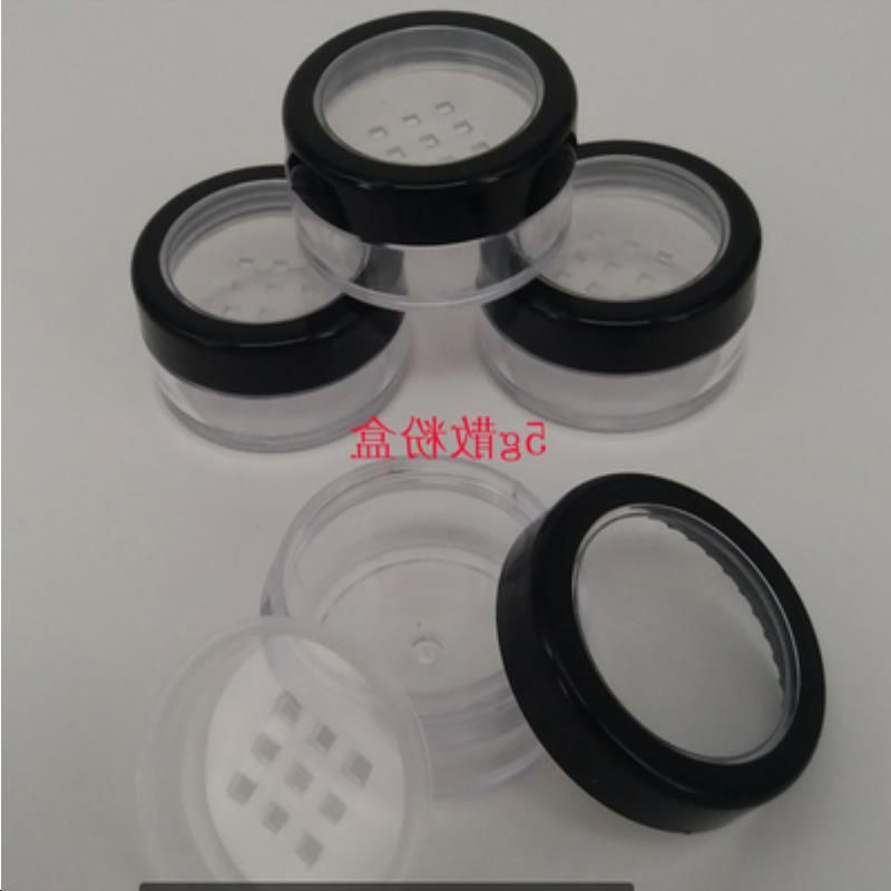 black rimmed lid+clear bottle+sifter