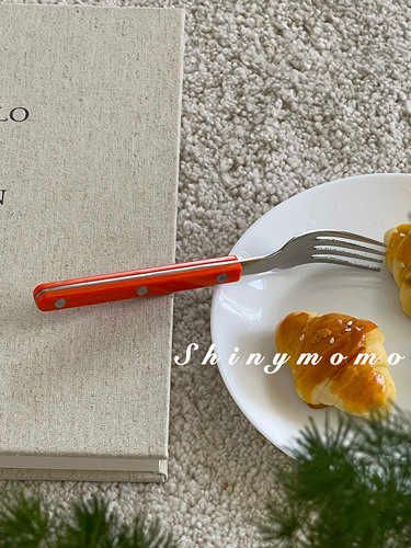 orange dessert fork